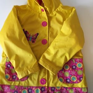 Adorable fleece-lined raincoat with hood.